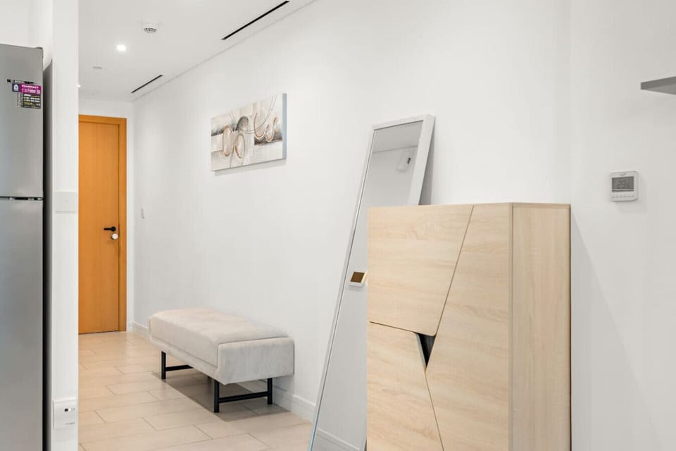 Entryway: Sleek and stylish entrance featuring modern decor and a warm welcome!