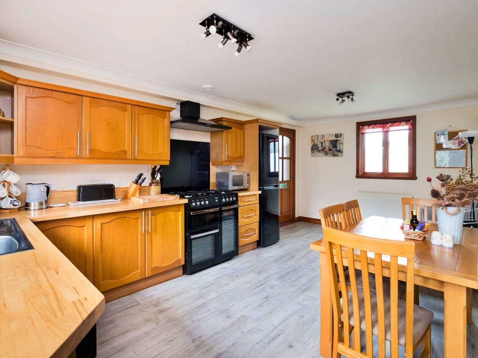 Furniture, Interior Design, Wood, Kitchen, Flooring, Ceiling, Countertop, Cabinetry, Floor, Room