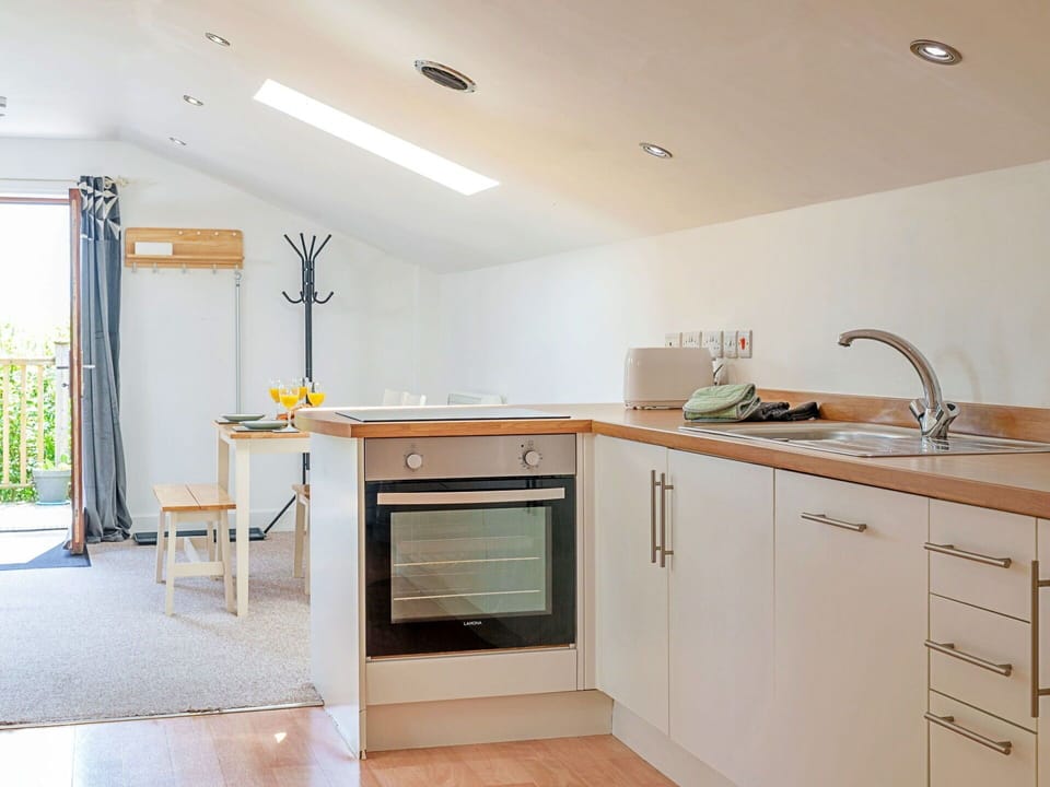 Furniture, Kitchen, Interior Design, Flooring, Countertop, Kitchen Appliance, Wood, Ceiling, Major Appliance, Cabinetry