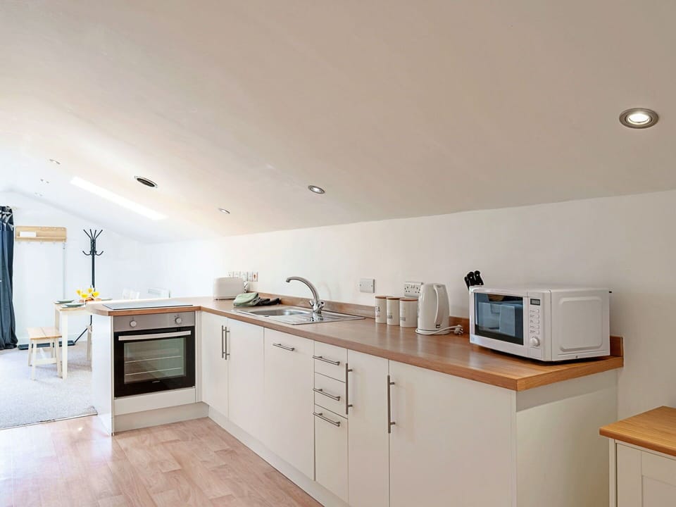Furniture, Interior Design, Flooring, Wood, Ceiling, Kitchen, Kitchen Appliance, Countertop, Floor, Cabinetry