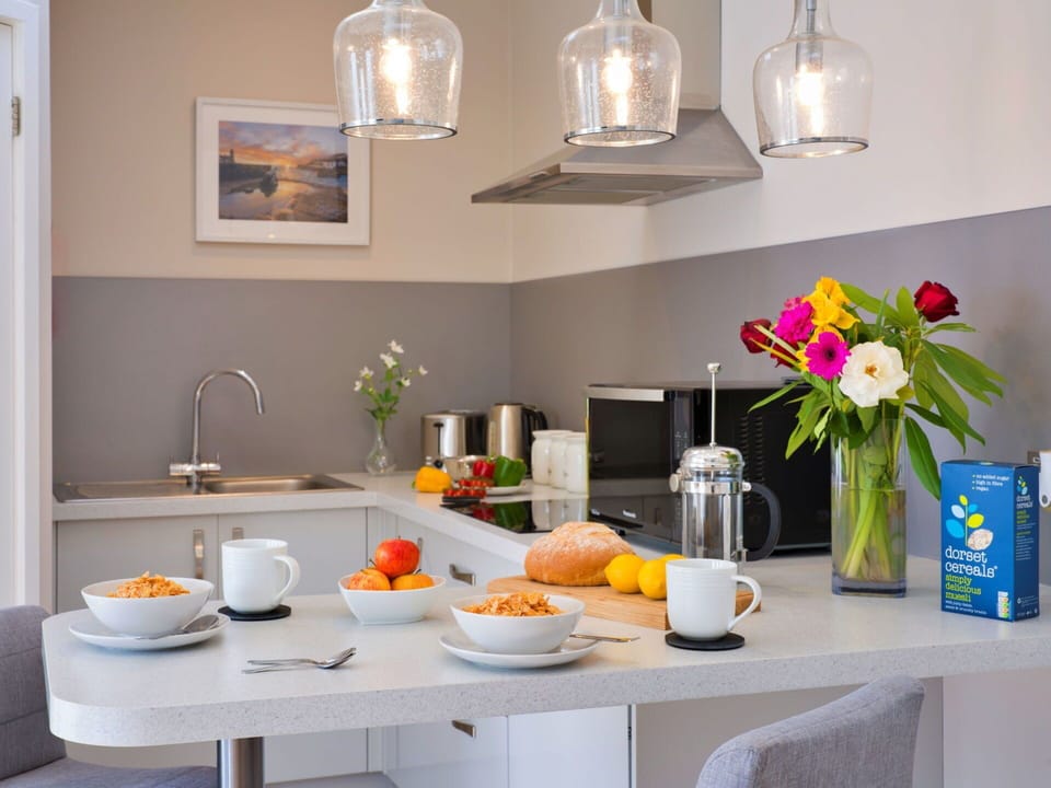 Furniture, Interior Design, Kitchen, Light Fixture, Countertop, Lighting, Ceiling, Home, Kitchen Appliance, Room