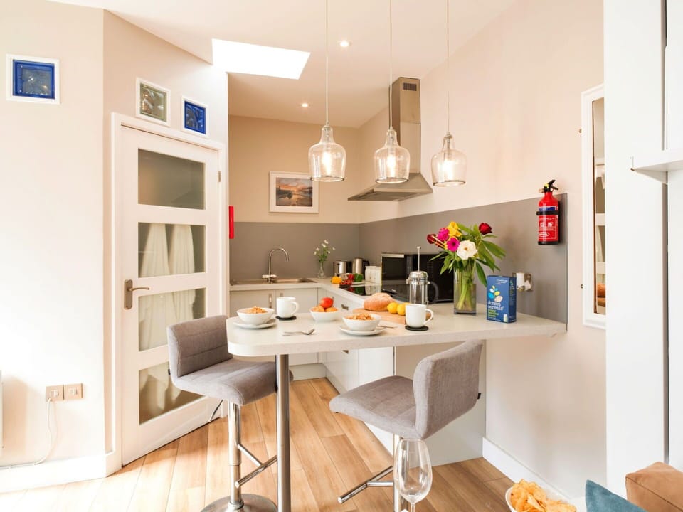 Furniture, Interior Design, Flooring, Wall, Chair, Kitchen, Floor, Wood, Countertop, Light Fixture