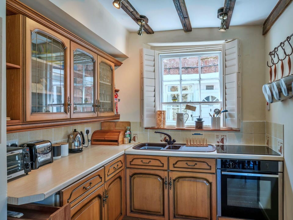 Kitchen, Countertop, Cabinetry, Wood, Interior Design, Kitchen Appliance, Furniture, Kitchen Sink, Lighting, Flooring