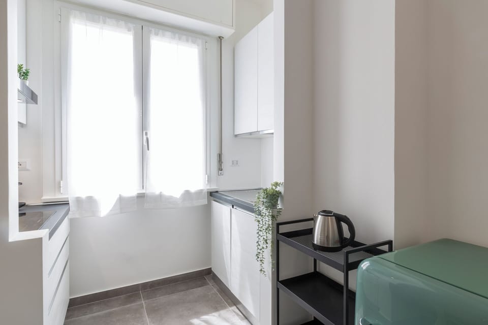 Comfort Apartment, Balcony | Living area | 32-inch Smart TV with digital channels