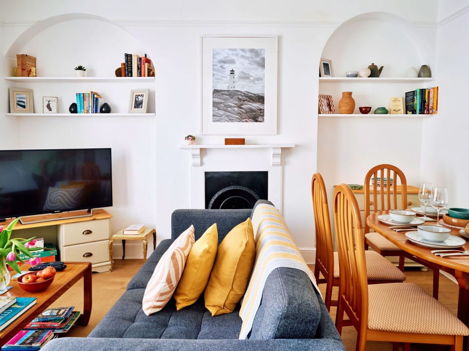 Furniture, Interior Design, Wall, Flooring, Wood, Couch, Room, Living Room, Floor, Lighting