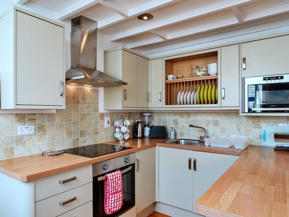 Countertop, Kitchen, Kitchen Appliance, Cabinetry, Furniture, Interior Design, Flooring, Major Appliance, Wood, Home Appliance