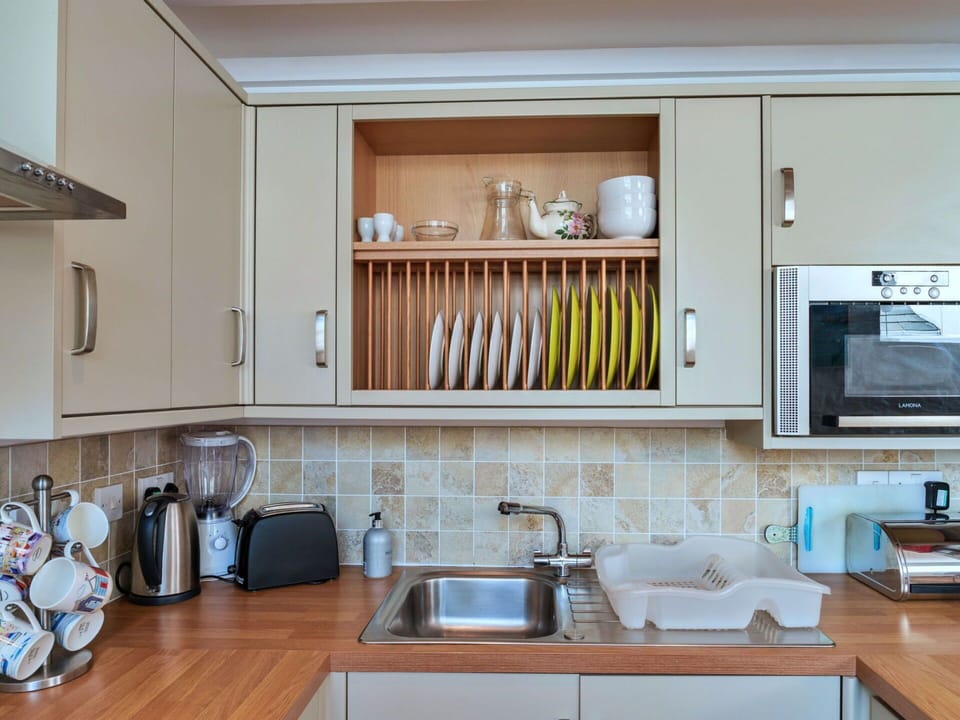 Kitchen Appliance, Kitchen, Cabinetry, Countertop, Furniture, Interior Design, Home Appliance, Wood, Major Appliance, Tableware