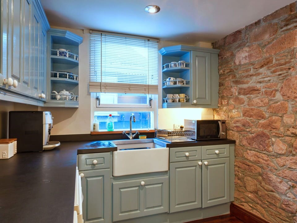 Kitchen, Countertop, Cabinetry, Kitchen Appliance, Interior Design, Furniture, Flooring, Major Appliance, Wood, Drawer