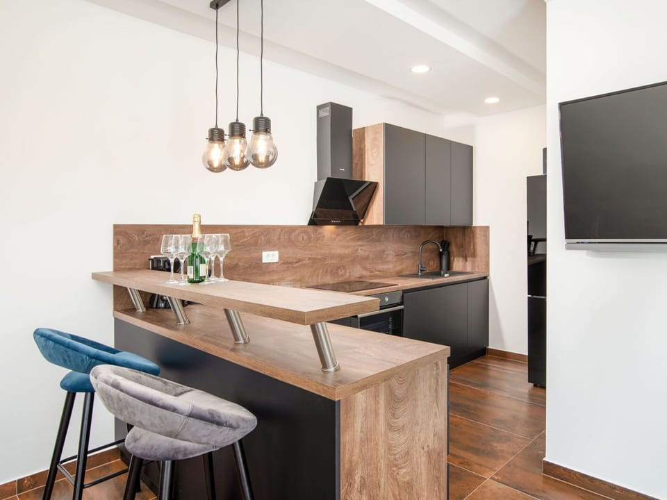 Furniture, Interior Design, Countertop, Flooring, Kitchen, Wood, Floor, Cabinetry, Light Fixture, Ceiling
