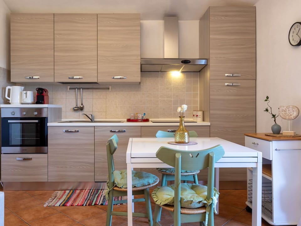 Furniture, Kitchen, Kitchen Appliance, Cabinetry, Major Appliance, Countertop, Interior Design, Flooring, Wood, Floor