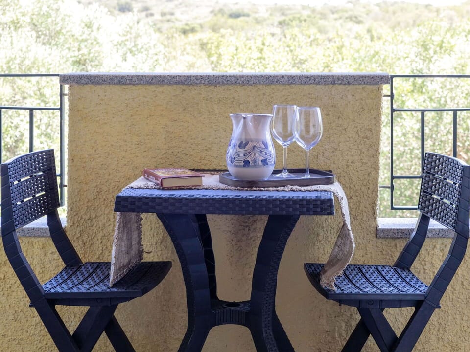 Furniture, Wood, Chair, Outdoor Furniture, Outdoor Table, Wicker, Wood Stain, Balcony, Armrest, Coffee Table