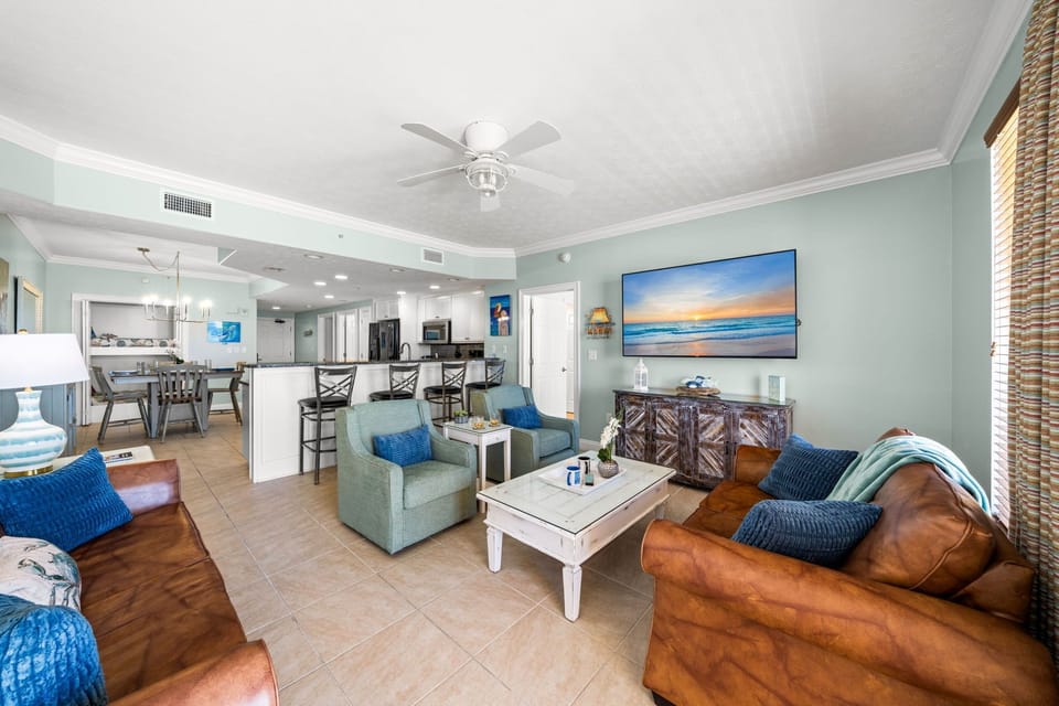 Open-concept living area with coastal-inspired decor and comfortable seating.