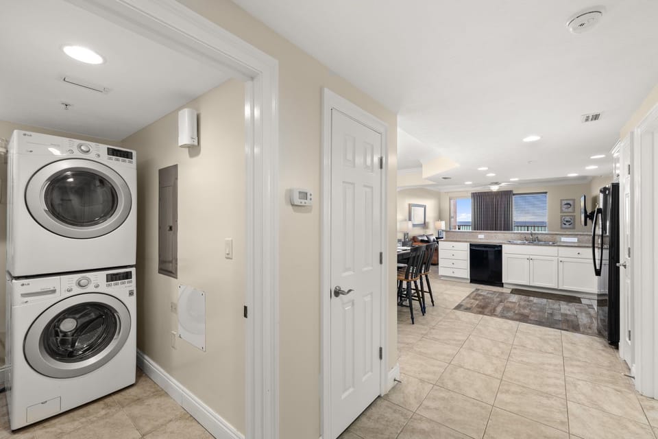 In-unit washer & dryer tucked neatly near the kitchen — pack light & stay fresh all trip long.