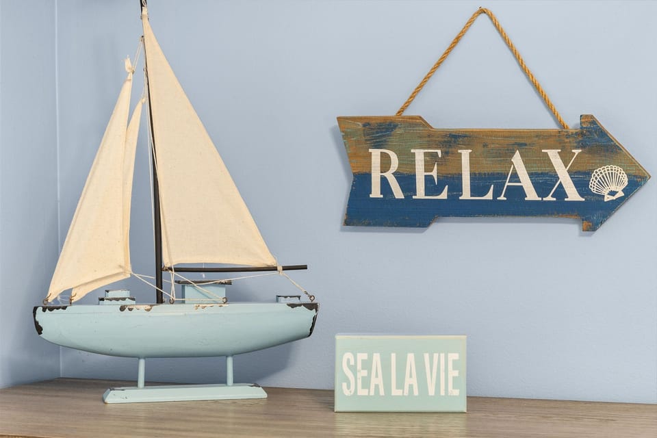 Decorative nautical-themed accents create a relaxing atmosphere
