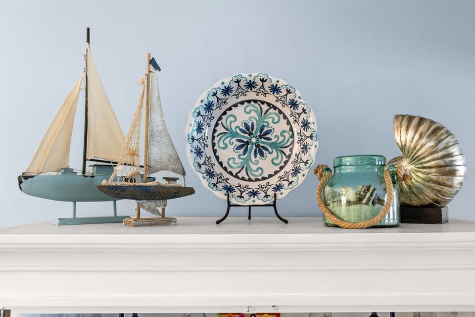 Decorative nautical-themed accents add a coastal touch to the space.