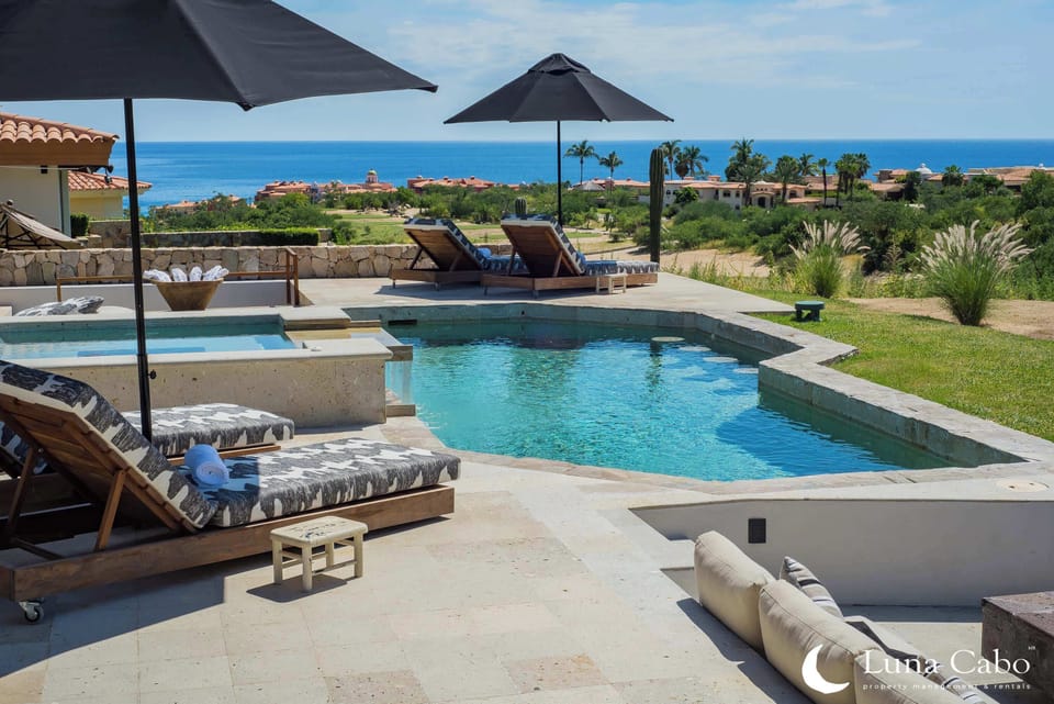 Enjoy the heated pool and hot tub, offering breathtaking ocean and golf course views