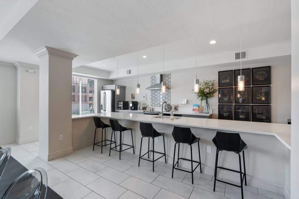 Cook and relax in style with our fully-equipped kitchen, featuring an induction stove and a cozy kitchen island.