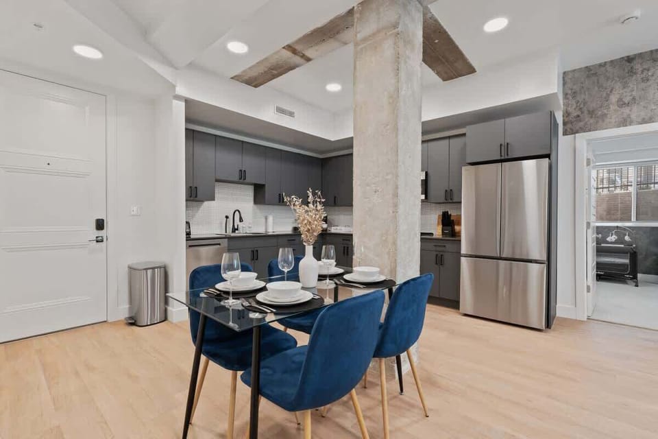 Dine in comfort at a chic four-person dining area just steps from the kitchen.