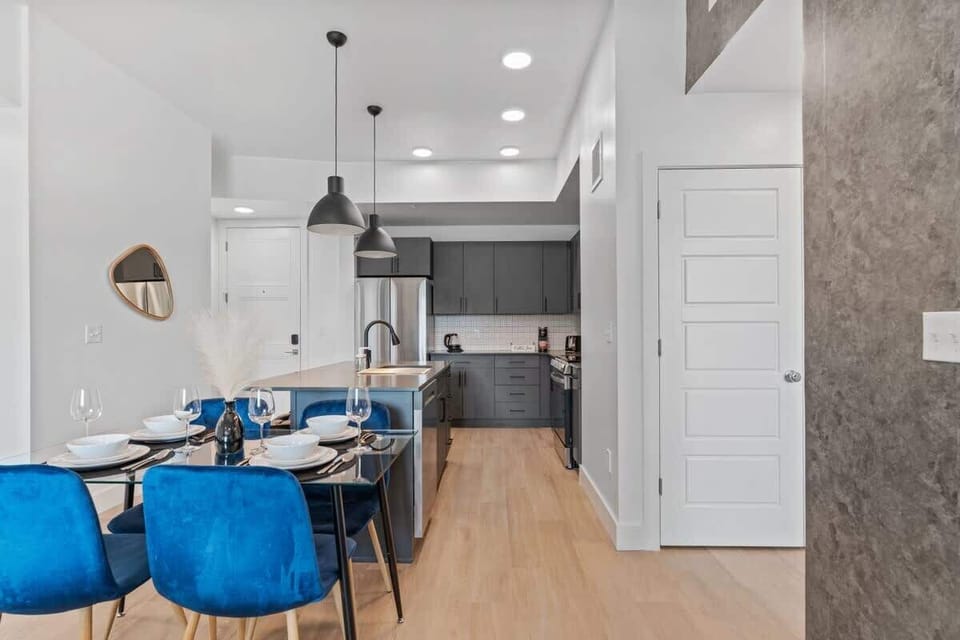 Dine in comfort at a chic four-person dining area just steps from the kitchen.