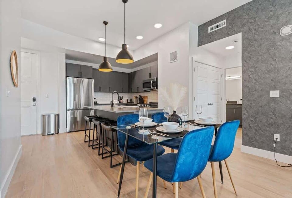 Dine in comfort at a chic four-person dining area just steps from the kitchen.
