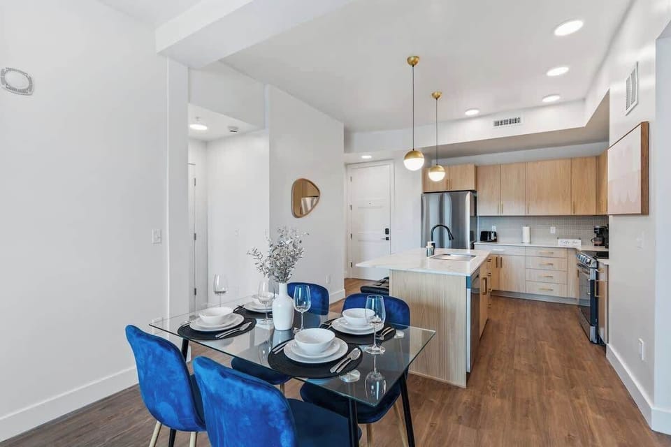 Dine in comfort at a chic four-person dining area just steps from the kitchen.