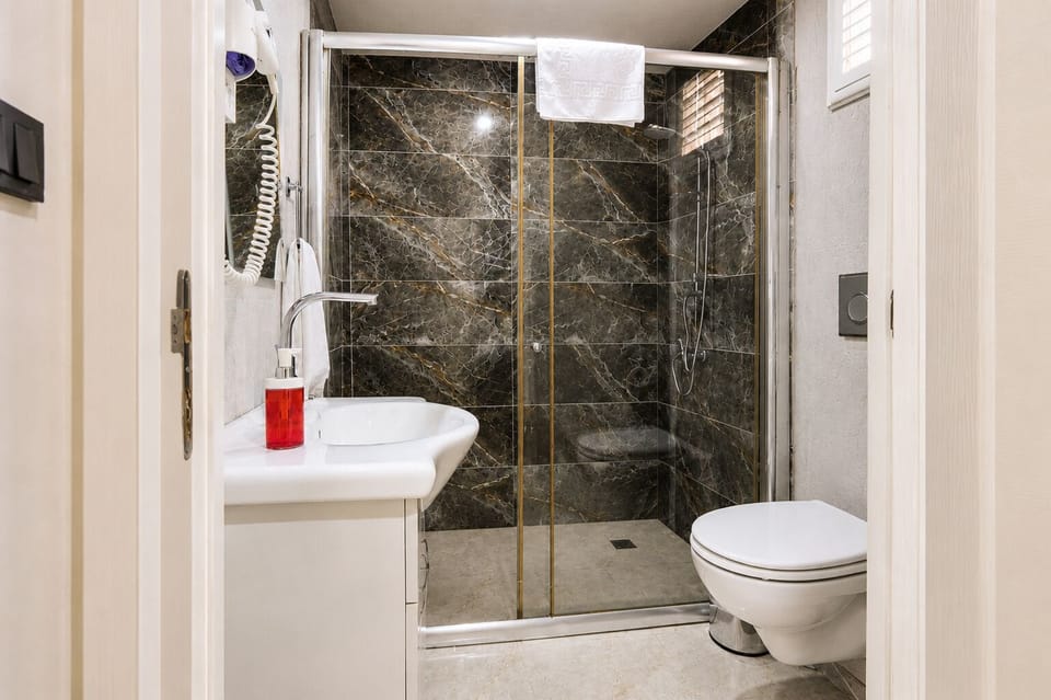 Family Studio Suite, Patio | Bathroom | Combined shower/tub, hair dryer, towels, soap