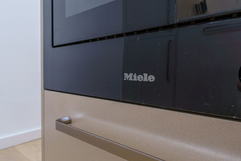Modern kitchen featuring streamlined storage and quality appliances.