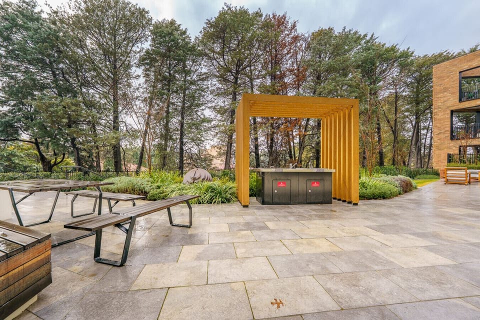Step outside, sip something warm, and enjoy a private nook framed by timber and fresh air.
