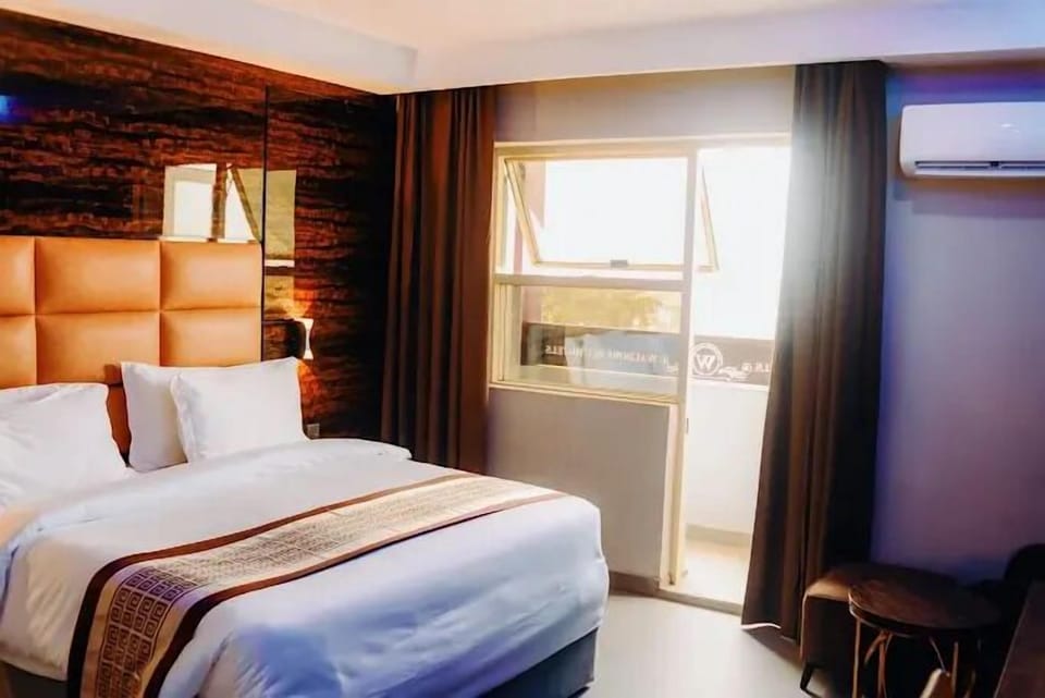 Economy Room, Balcony, City View | Desk, laptop workspace, blackout drapes, soundproofing