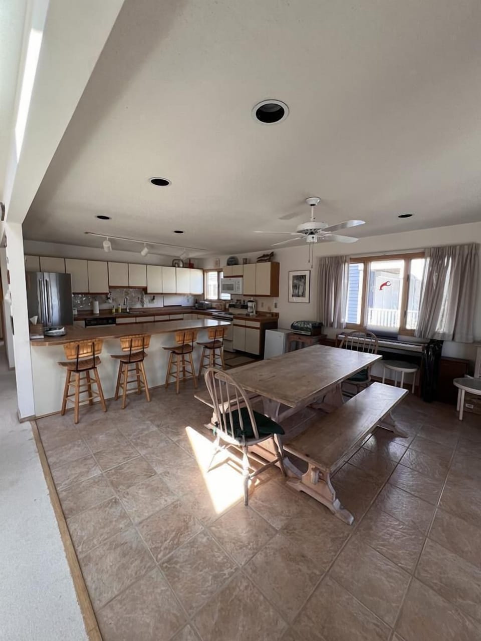The inviting open-concept kitchen and dining area boasts ample space for family meals and entertaining.