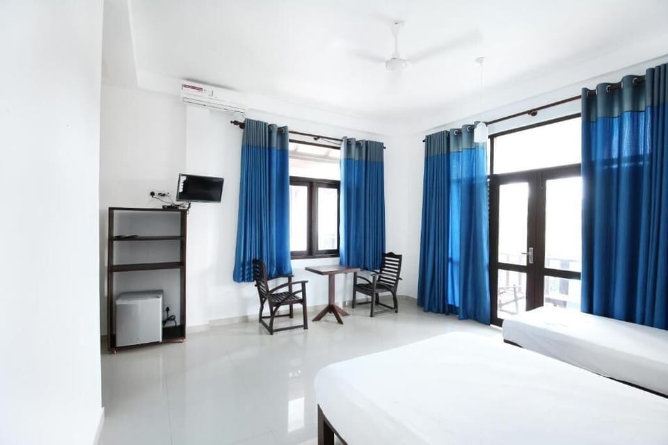 Deluxe Triple Room, Balcony, Pool View | Desk, free WiFi