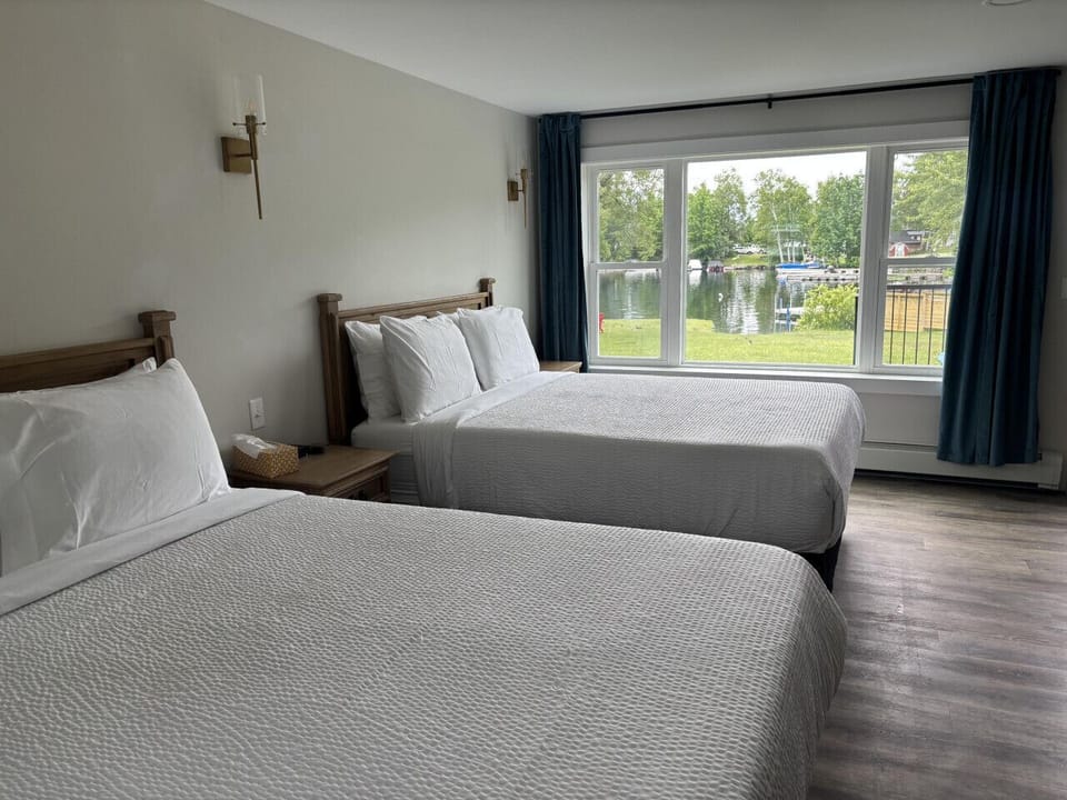 Spacious room with two cozy queen beds—perfect for families or friends.