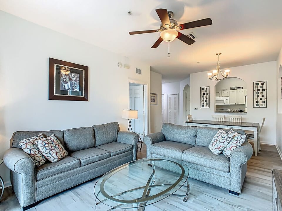 Comfortable living room with sofa set and open layout.