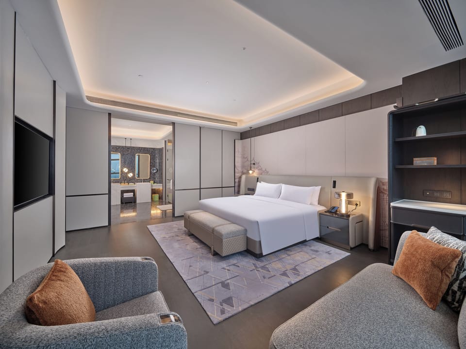 Presidential Suite, 1 King Bed | Living area | 55-inch LCD TV with satellite channels