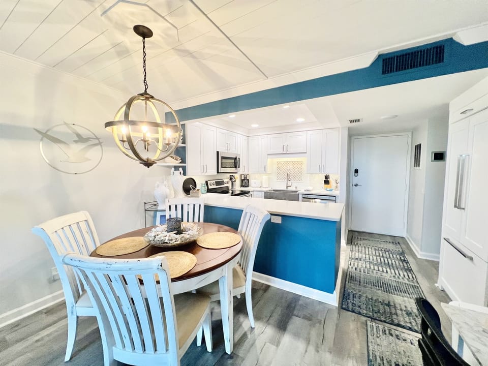 Bright dining space with coastal vibes, perfect for group meals or game night.
