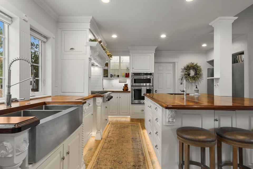 Gourmet kitchen with double sinks, gas stove and double refrigerator/freezers