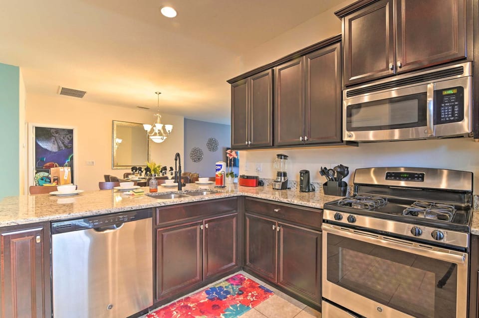 Modern kitchen with stainless steel appliances and granite countertops