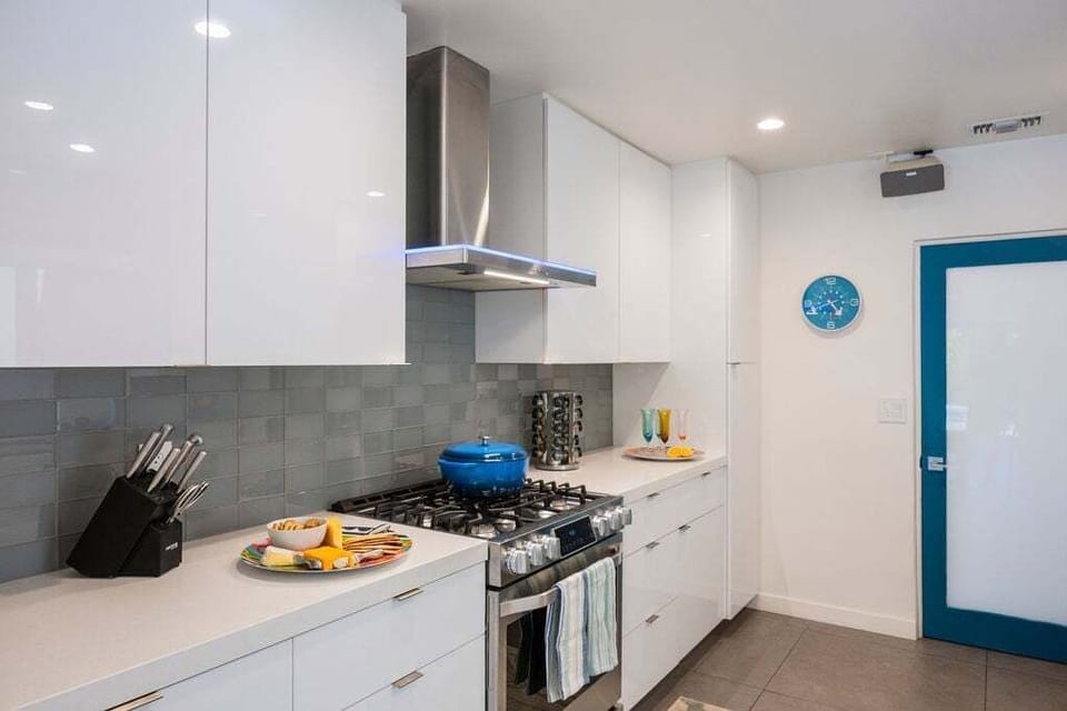 Bright and functional kitchen with ample prep space and modern finishes throughout.
