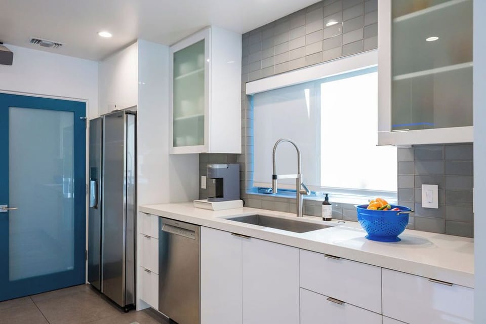 Fully equipped kitchen featuring modern appliances and everything needed for home-cooked meals.