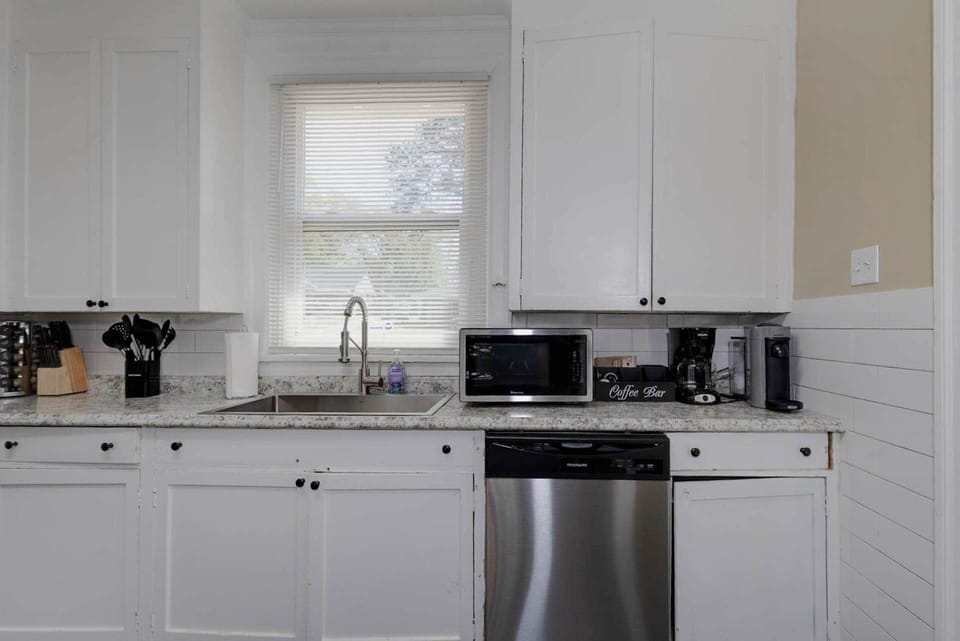 Microwave, Cooking Utensils, Spices, and a Nespresso Coffee Machine