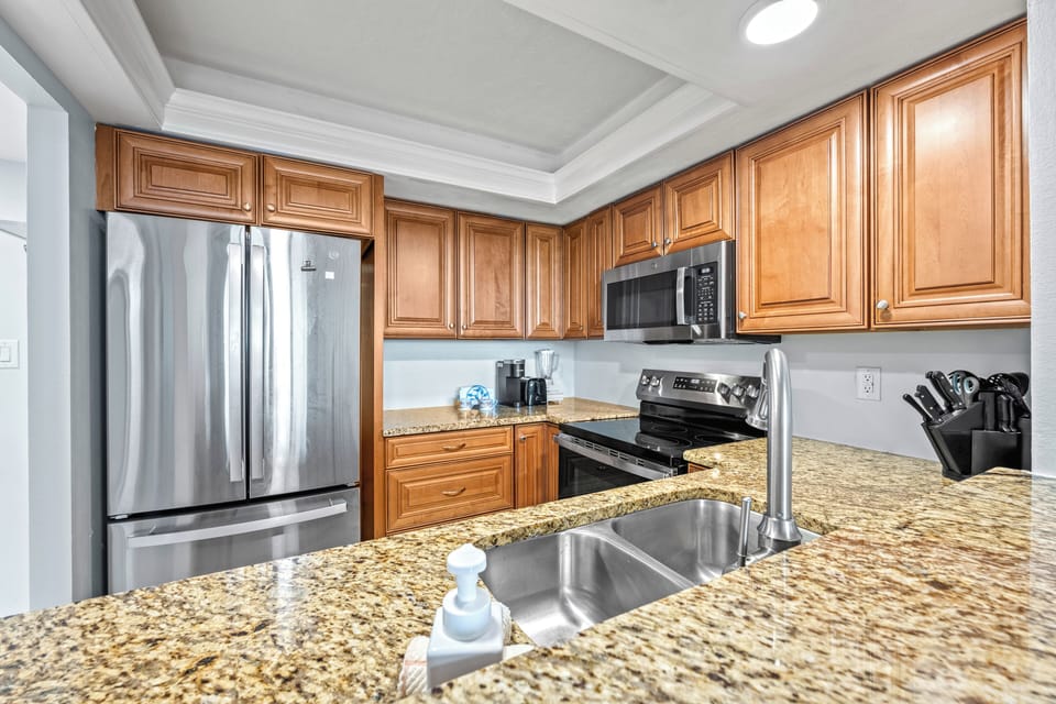 Imagine fresh seafood sizzling as the aroma fills this sleek, sunlit space where cooking feels like a breeze.
