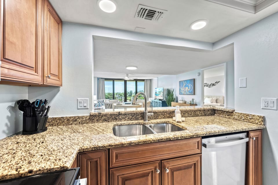 Cook up fresh island flavors while staying part of the conversation—the open kitchen flows seamlessly into the bright living room, where laughter and sunset light fill the space.