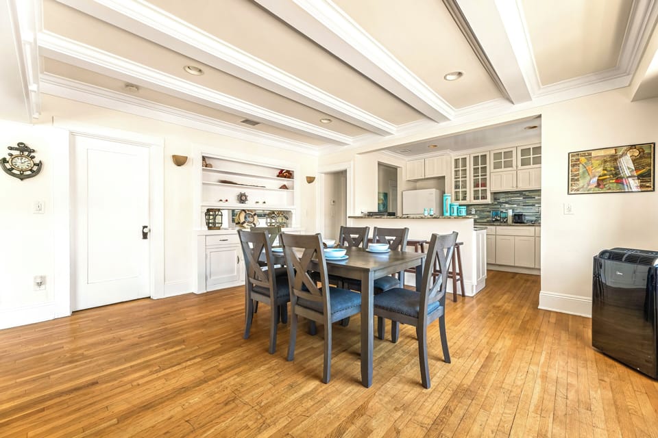 Modern dining area with seating for 6, perfect for family meals, game nights, remote work, or gatherings. Enjoy a comfortable and stylish space designed for dining, entertaining, and making memorable moments during your stay