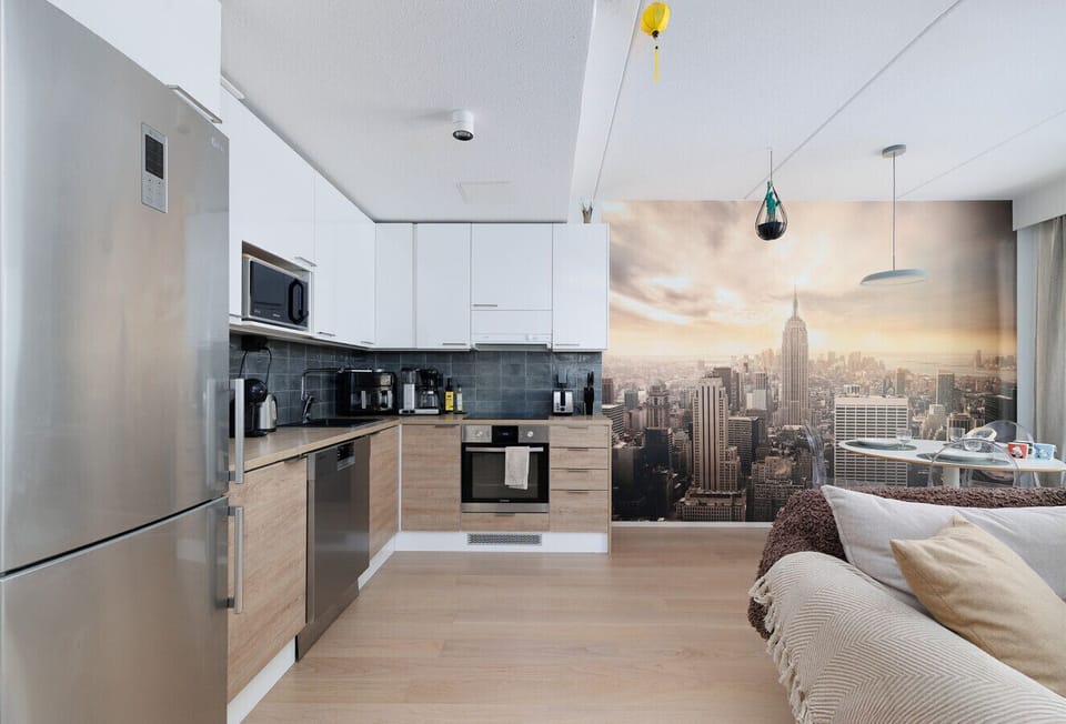 Modern open-layout design with the kitchen, dining, and living room integrated into a single welcoming space.