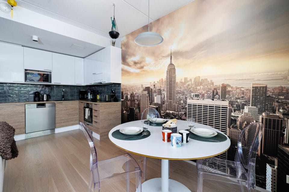 Modern open-layout design with the kitchen, dining, and living room integrated into a single welcoming space.