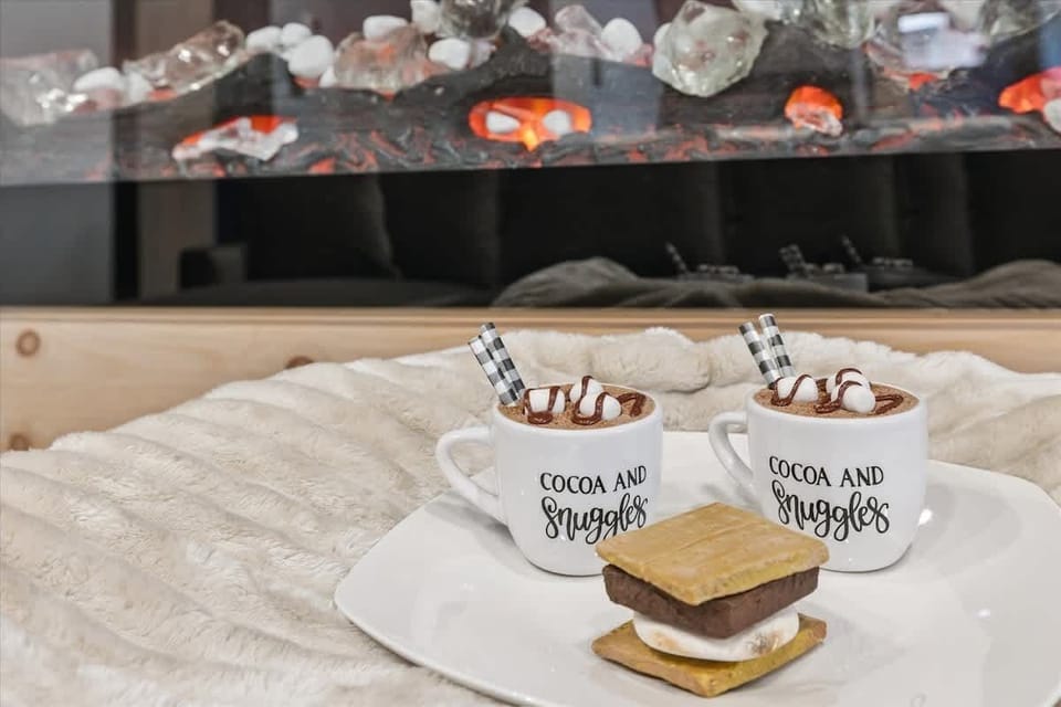 Indulge in rich hot cocoa and s'mores by the glowing fireplace!