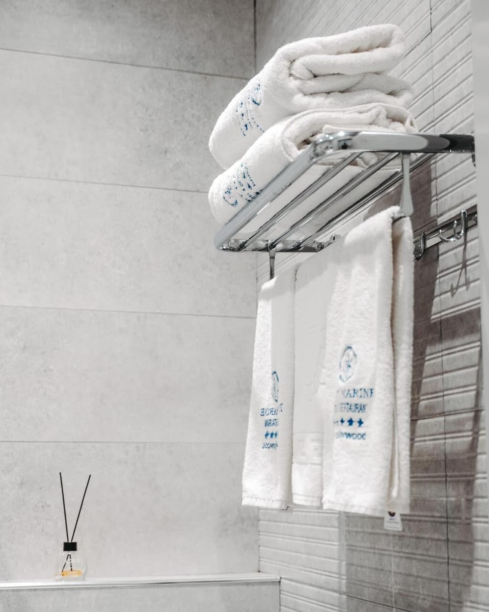 Bathtub, hair dryer, bathrobes, slippers