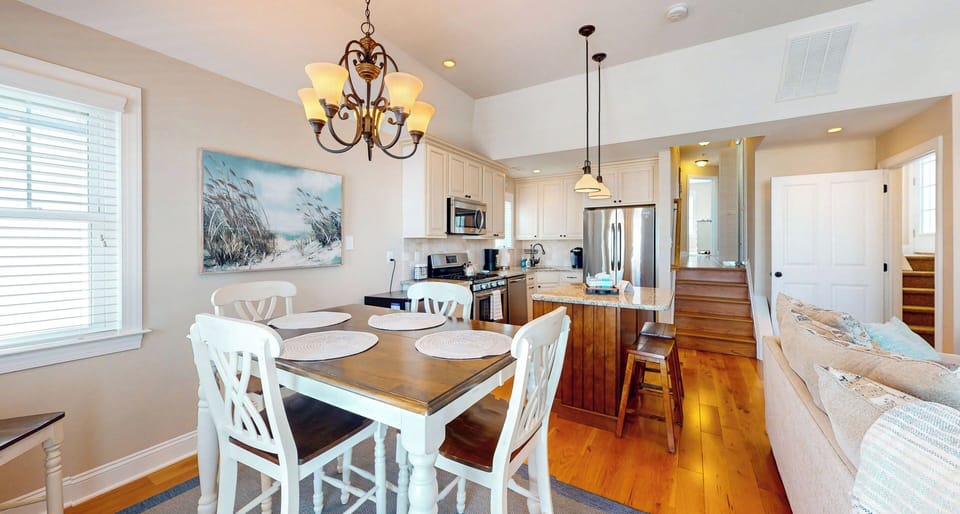 Kitchen area with table for entertaining guests.