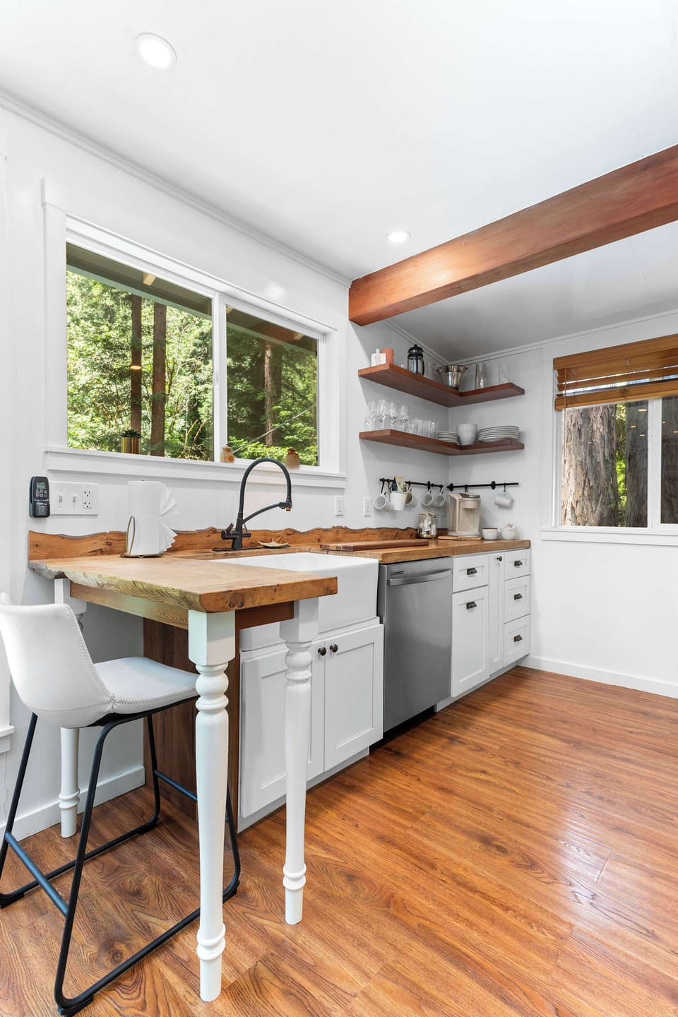 The charming kitchen is on the upper level above the primary bedroom.