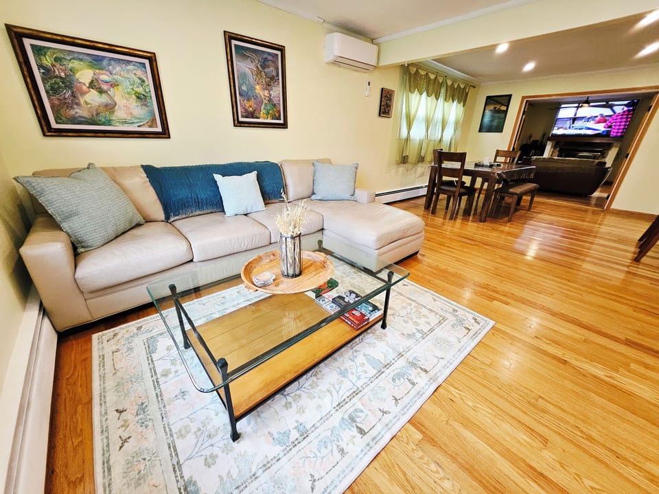 The living room has an open layout into the dining room.
